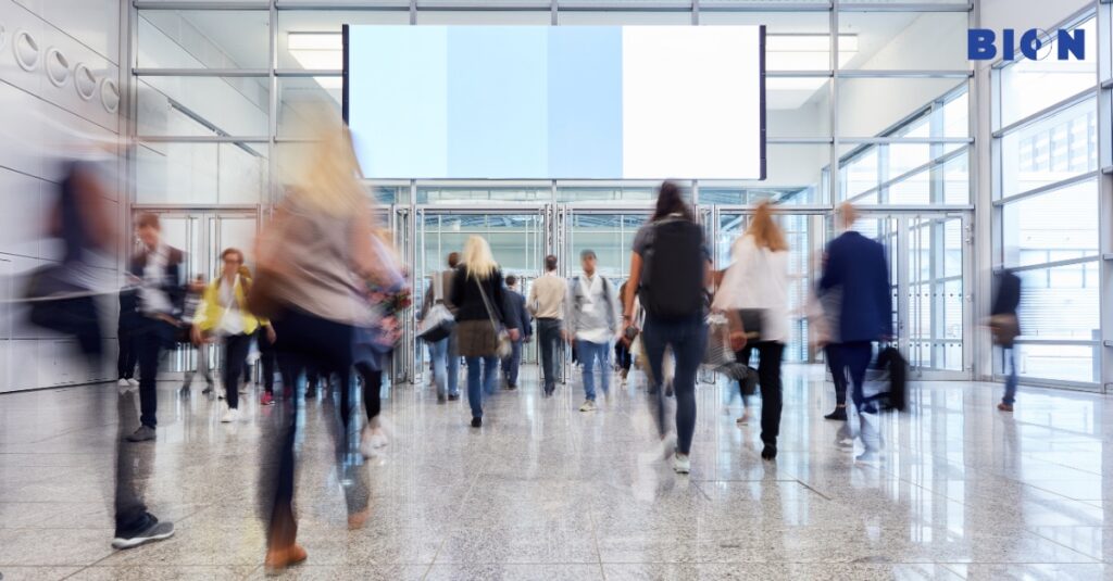 Contactless visitor check-in kiosk in a modern office lobby.